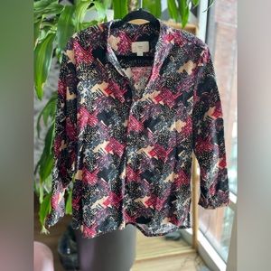 ZED Women’s mid button-up multi color shirt.